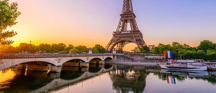 A river cruise on the Seine passing by the Eiffel Tower.