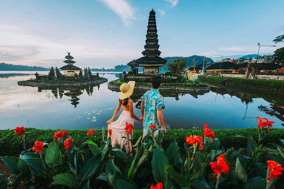 Couple at Ulun Datu Bratan Temple in Bali, Indonesia