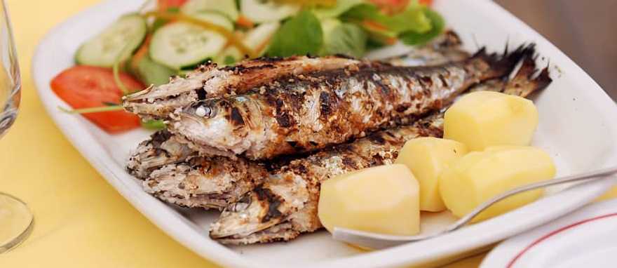 Grilled sardine served at a restaurant in Lisbon, Portugal