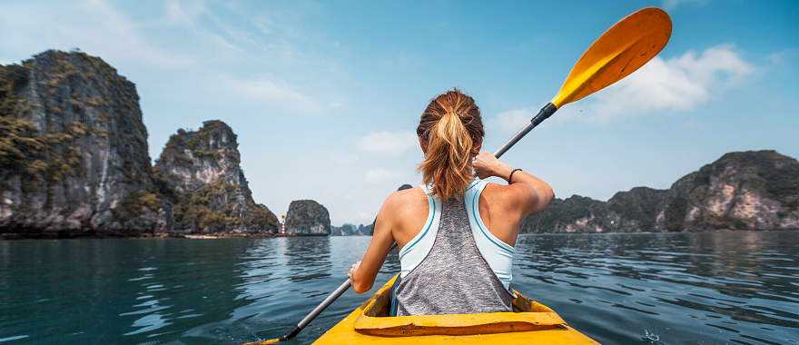 Woman kayaking in Ha Long Bay, Vietnam