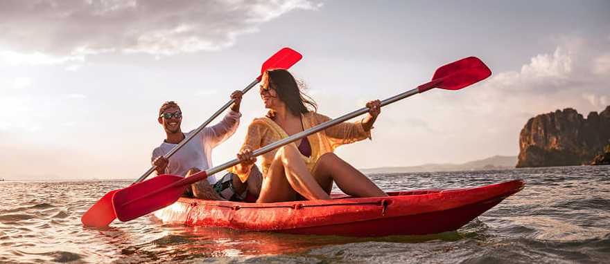 mmersive Getaway Vacation to Thailand for Couples Happy couple kayaking in Thailand