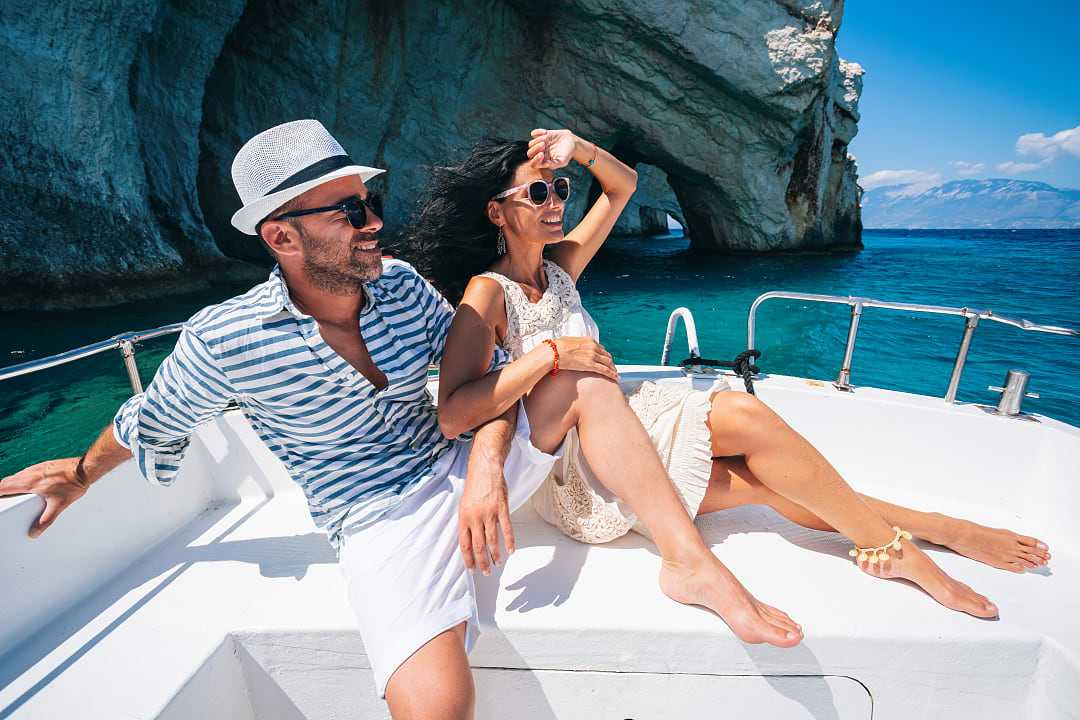 Couple on a luxury yacht sailing the islands in Greece