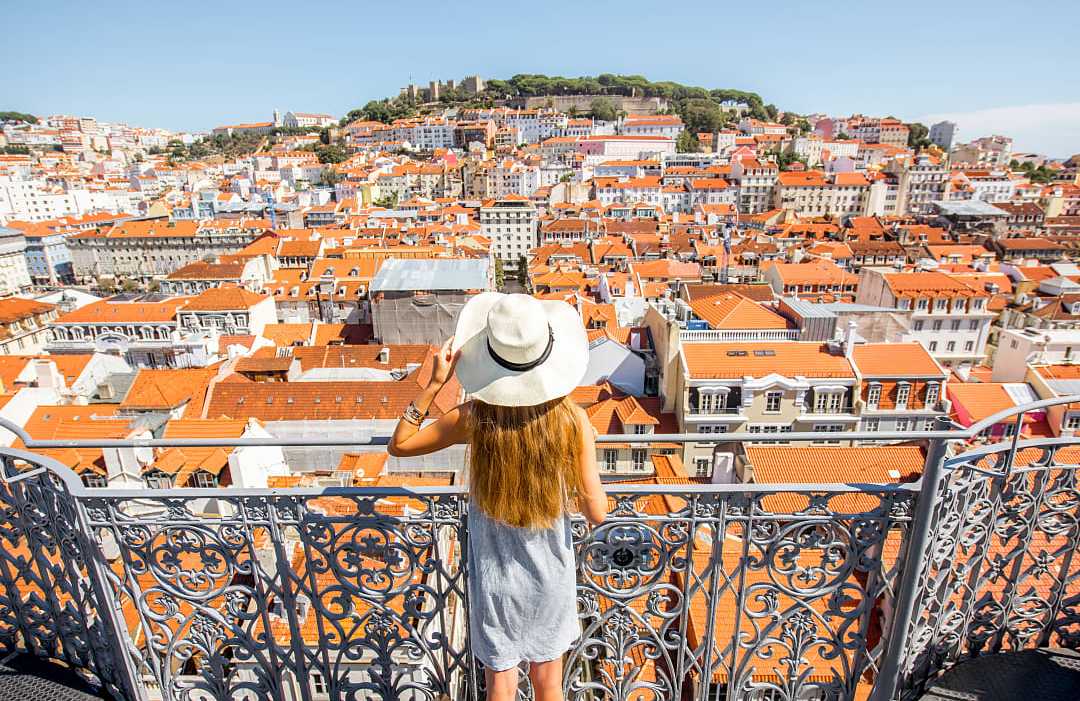 Female traveler at overlook in Lisbon, Portugal