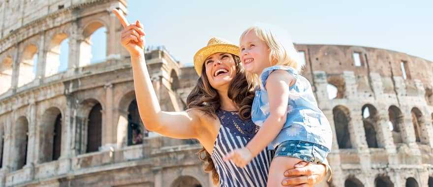 Mother and daughter outside the Roman Colosseum in Italy