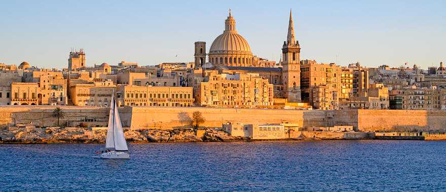 Sailboat along seafront of Valletta on the Island of Malta in the Mediterranean