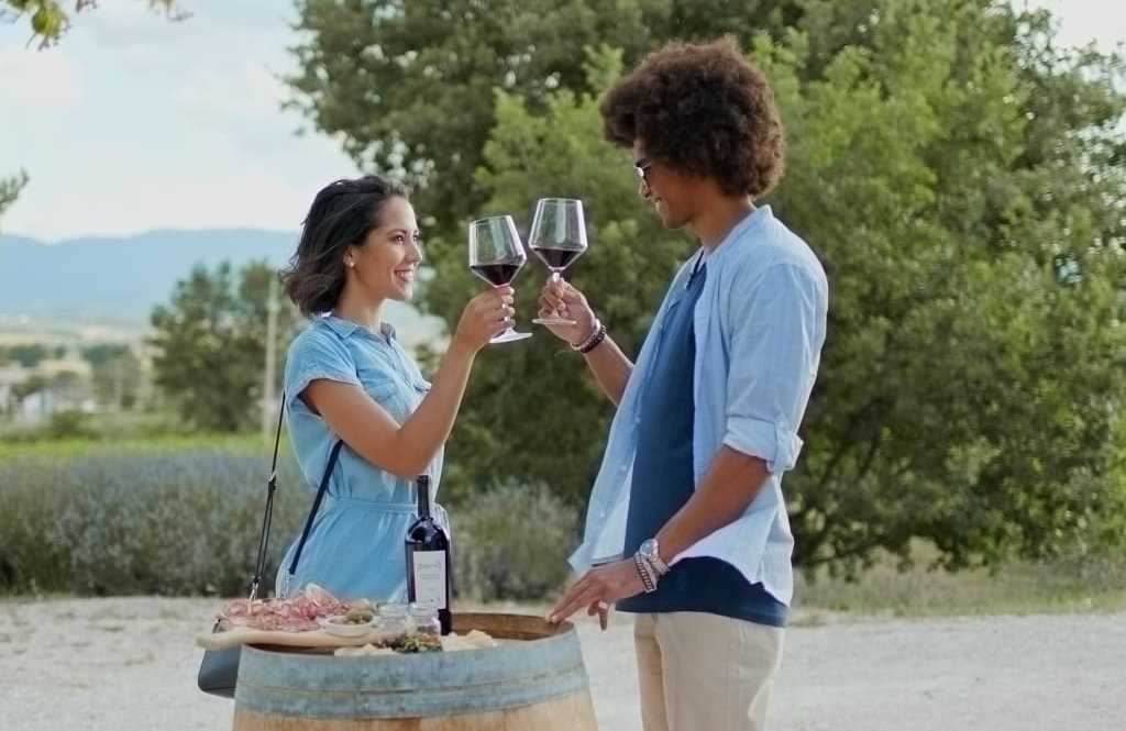 A couple is tasting young wine at one of the wineries in Italy, Umbria region