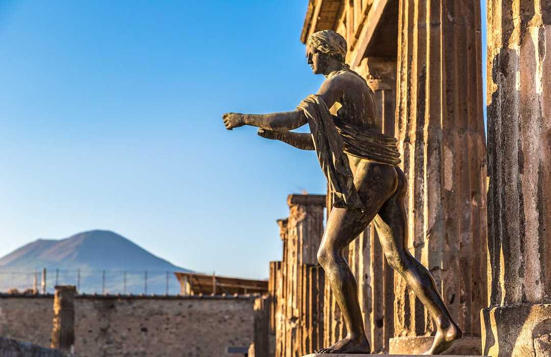 Bronze Apollo statue of the Temple of Apollo ruins at Pompeii in Naples, Italy