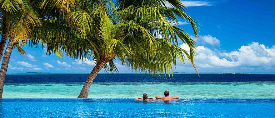 Couple in the pool at beach resort in Mauritius 