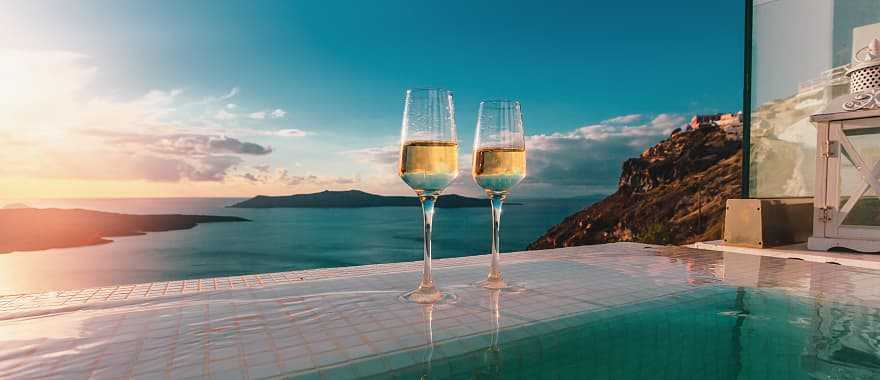 Mykonos Grand Hotel and Resort Pool area during sunset in Greece.