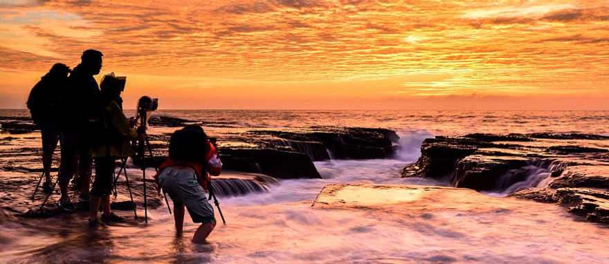 Sydney, Australia Photographers capturing sunrise on the North Narrabeen coast near Sydney, Australia