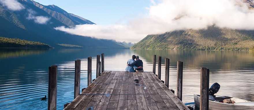 Couple sitting on the pier at Nelson Lake National Park