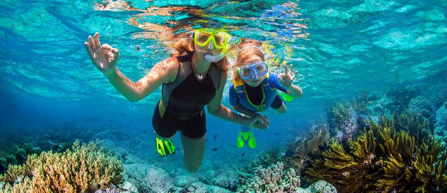 Mother and daughter snorkeling 