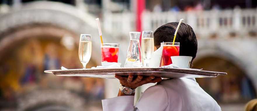 Venice, Italy Waiter serving aperitif drinks in Venice, Italy