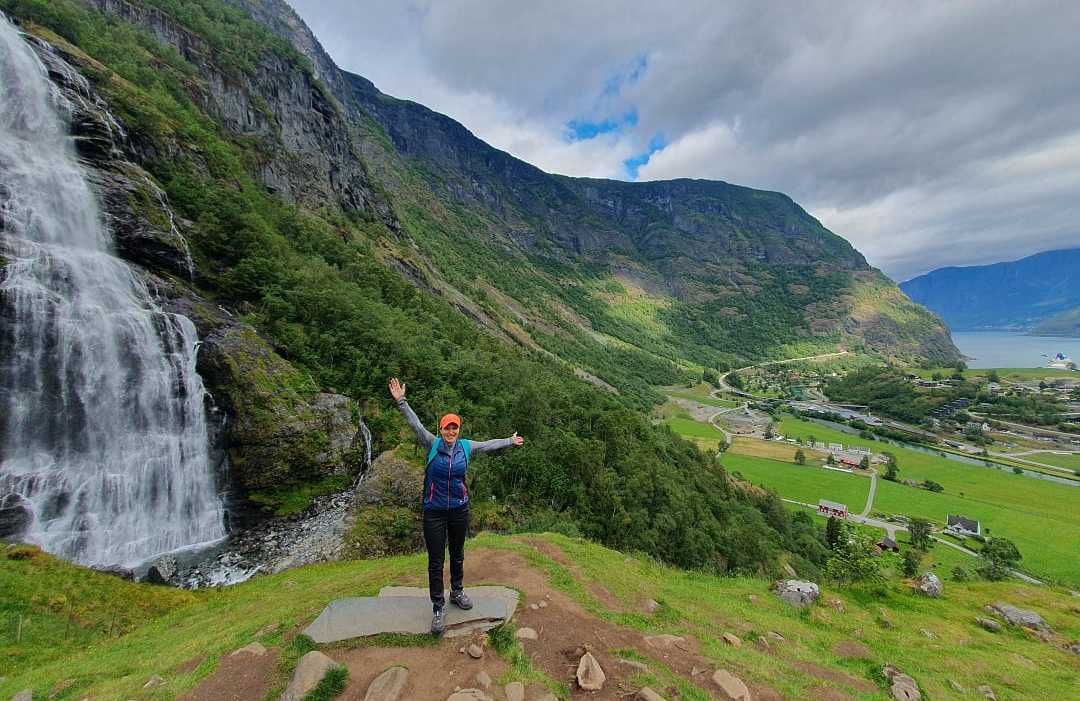 Olena at a waterfall in Flåm, Norway