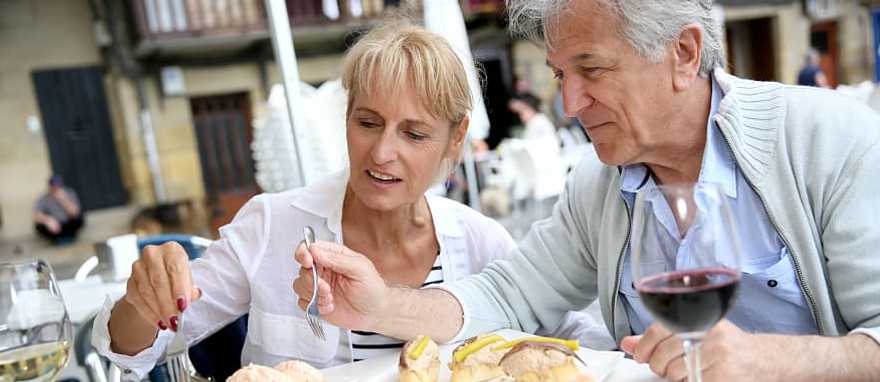 Couple enjoys some food and wine in Spain Couple enjoys some food and wine in Spain