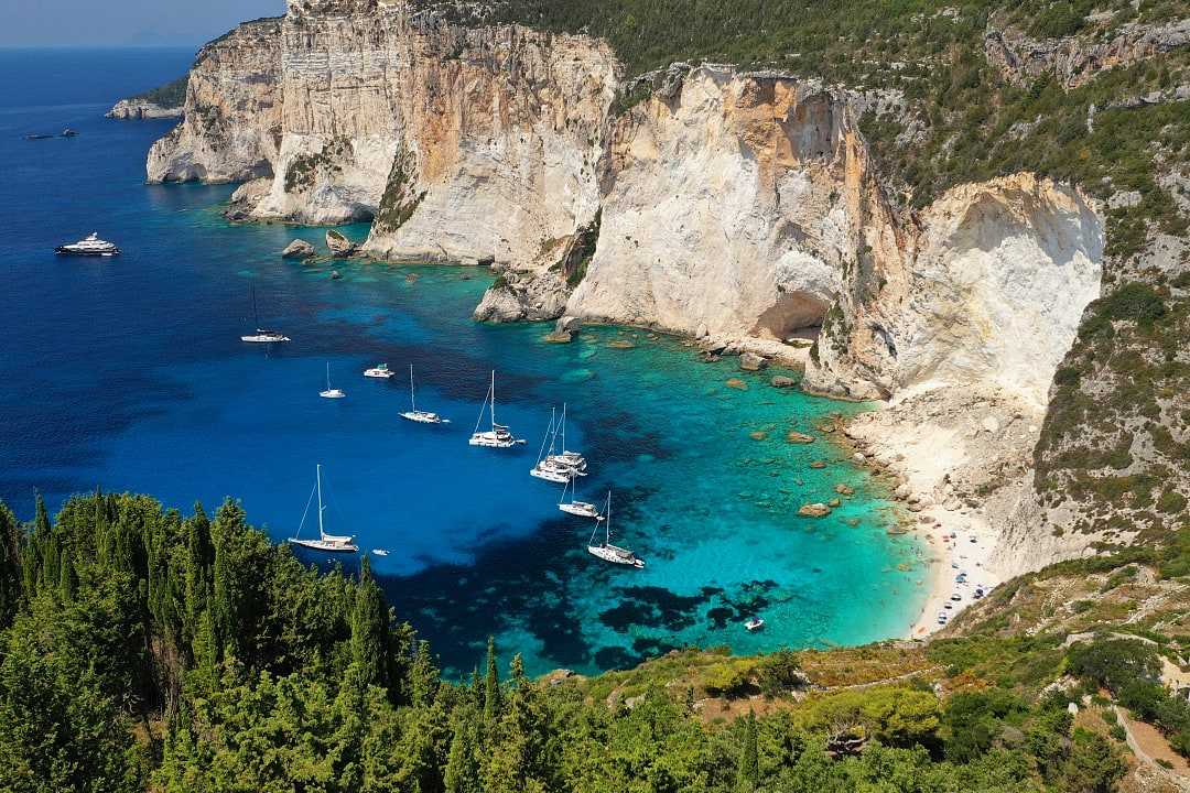 Boats moored at Erimitis Bay on Paxos Island, Greece