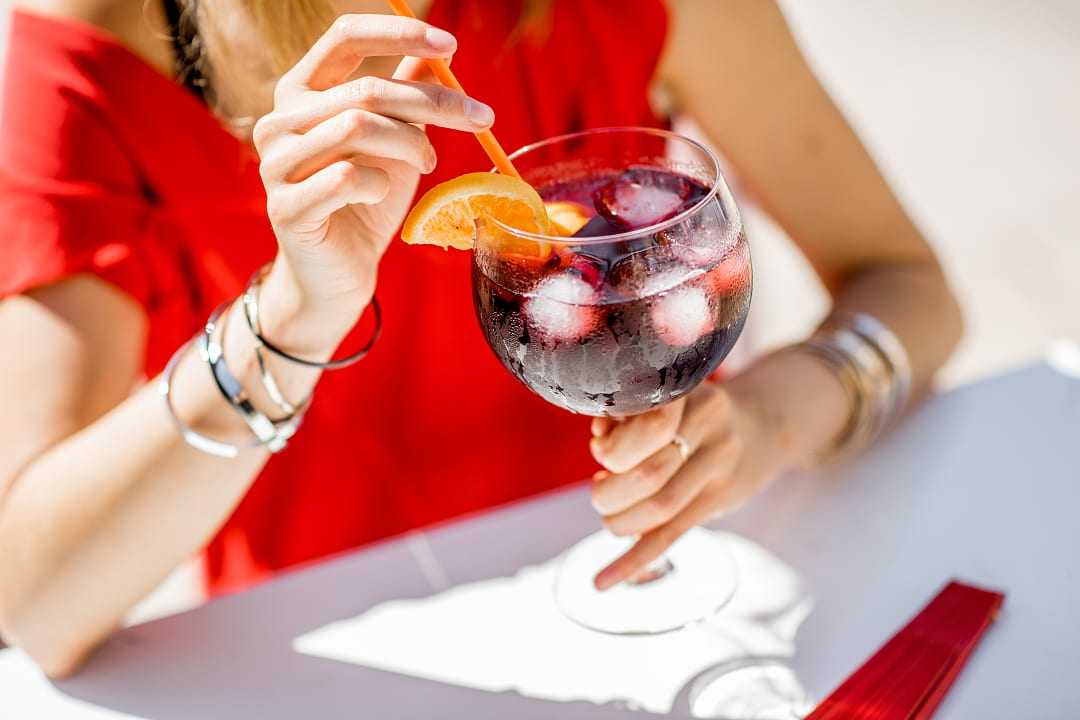 Woman drinking sangria in Barcelona, Spain