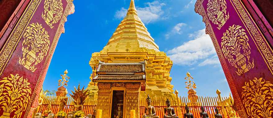 Golden temple framed by ornate archway at Wat Phra That Doi Duthep in Chiang Mai, Thailand Golden temple framed by ornate archway at Wat Phra That Doi Duthep in Chiang Mai, Thailand