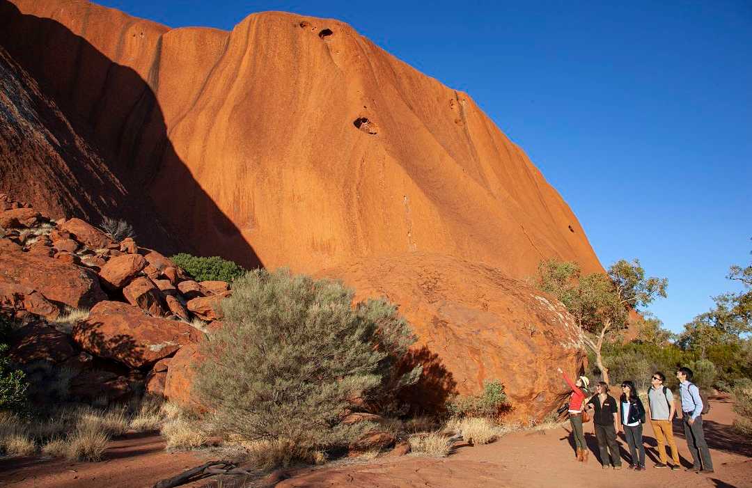 Family on private tour at Uluru in the Northern Territory, Australia