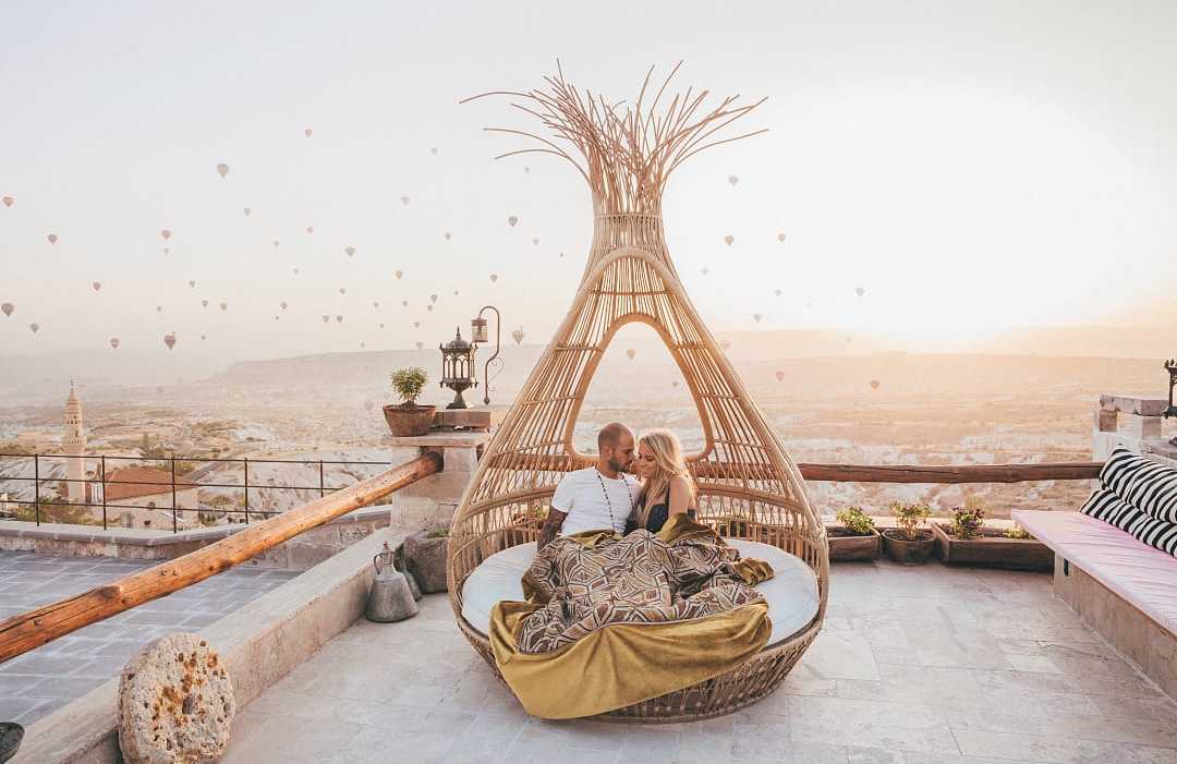 Couple in Cappadocia enjoying the sunrise in Turkey
