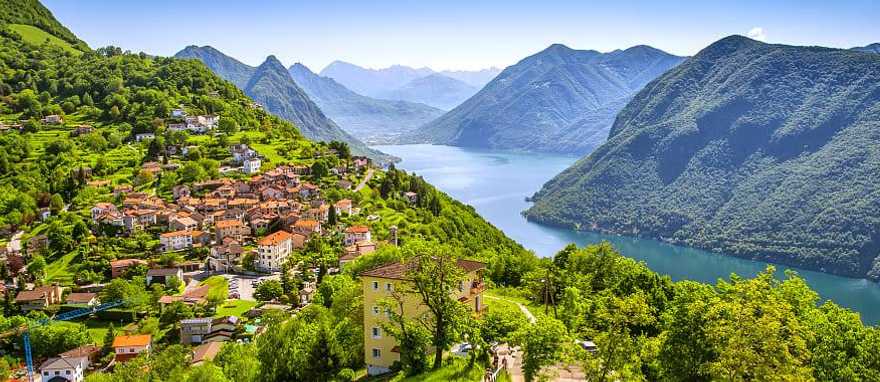 View to Lugano city, Lugano lake and Monte San Salvatore from Monte Bre, Ticino, Switzerland. View to Lugano city, Lugano lake and Monte San Salvatore from Monte Bre, Ticino, Switzerland.