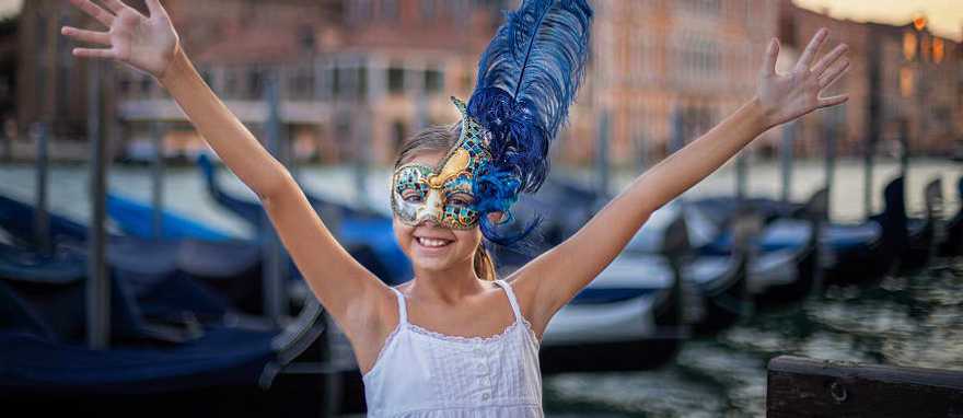 The Wonders of Italy Family-Friendly Tour - Venice, Italy Young girl wearing carnival mask in Venice, Italy
