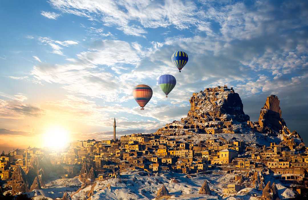 Hot air balloons flying over spectacular Cappadocia in Turkey