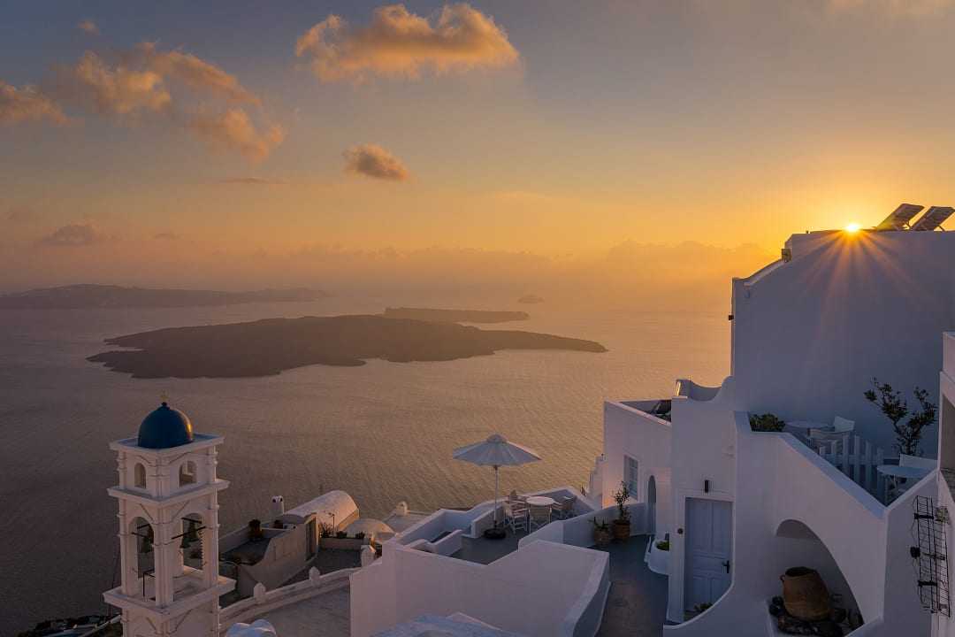 Sunset over Santorini’s whitewashed paradise.