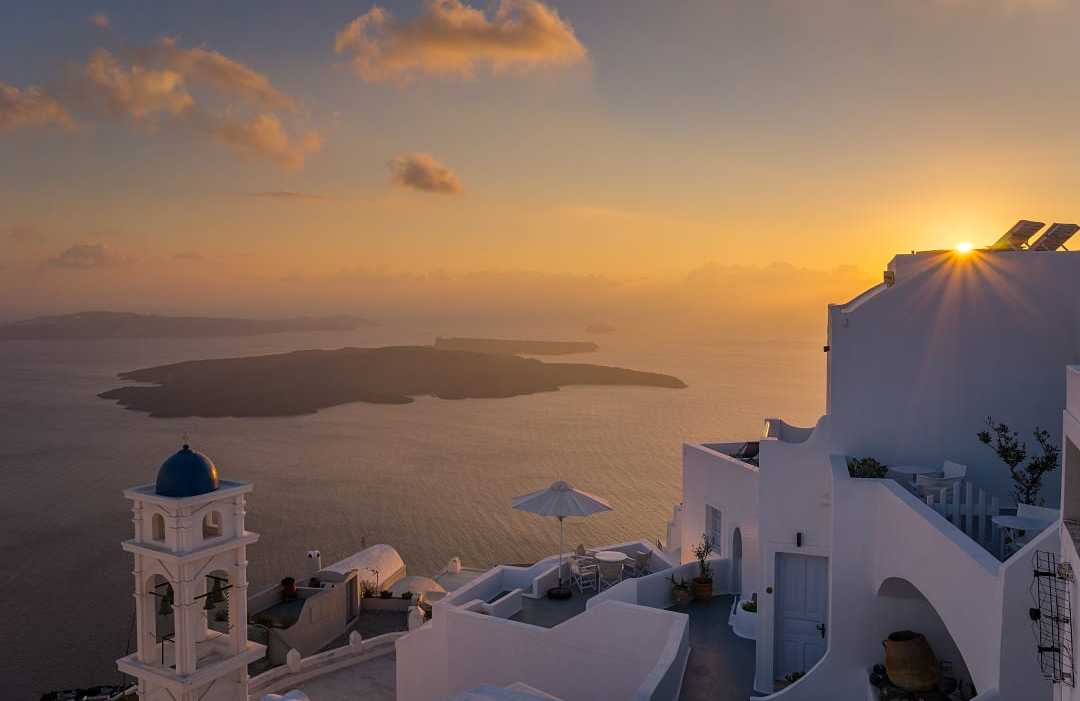 Sunset over Santorini’s whitewashed paradise.