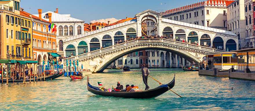 Gondola ride near the Rialto Bridge on the Grand Canal in Venice, Italy Gondola ride near the Rialto Bridge on the Grand Canal in Venice, Italy