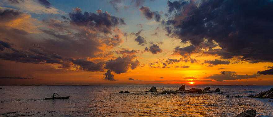 Canoeing Lake Malawi at sunset