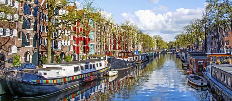 Dutch buildings and canal in Amsterdam, Netherlands Dutch buildings and canal in Amsterdam, Netherlands